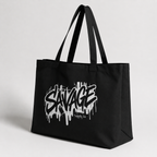 product angled view black tote bag savage logo minimal studio graphic streetwear
