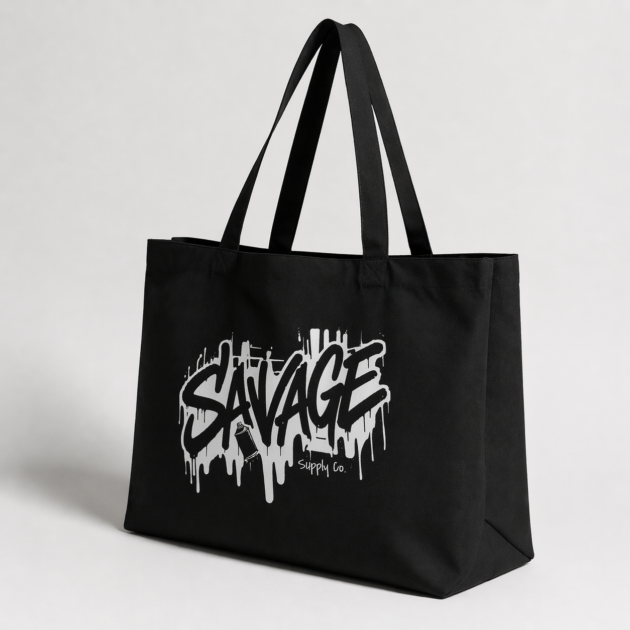 product angled view black tote bag savage logo minimal studio graphic streetwear