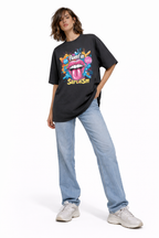 female model full body front pose wearing oversized black graphic streetwear t shirt fluent in sarcasm colorful pop art lips design streetwear fashion