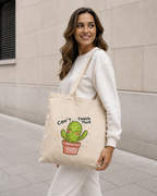 Woman modeling natural Nöiré cactus graphic tote bag, front lifestyle view