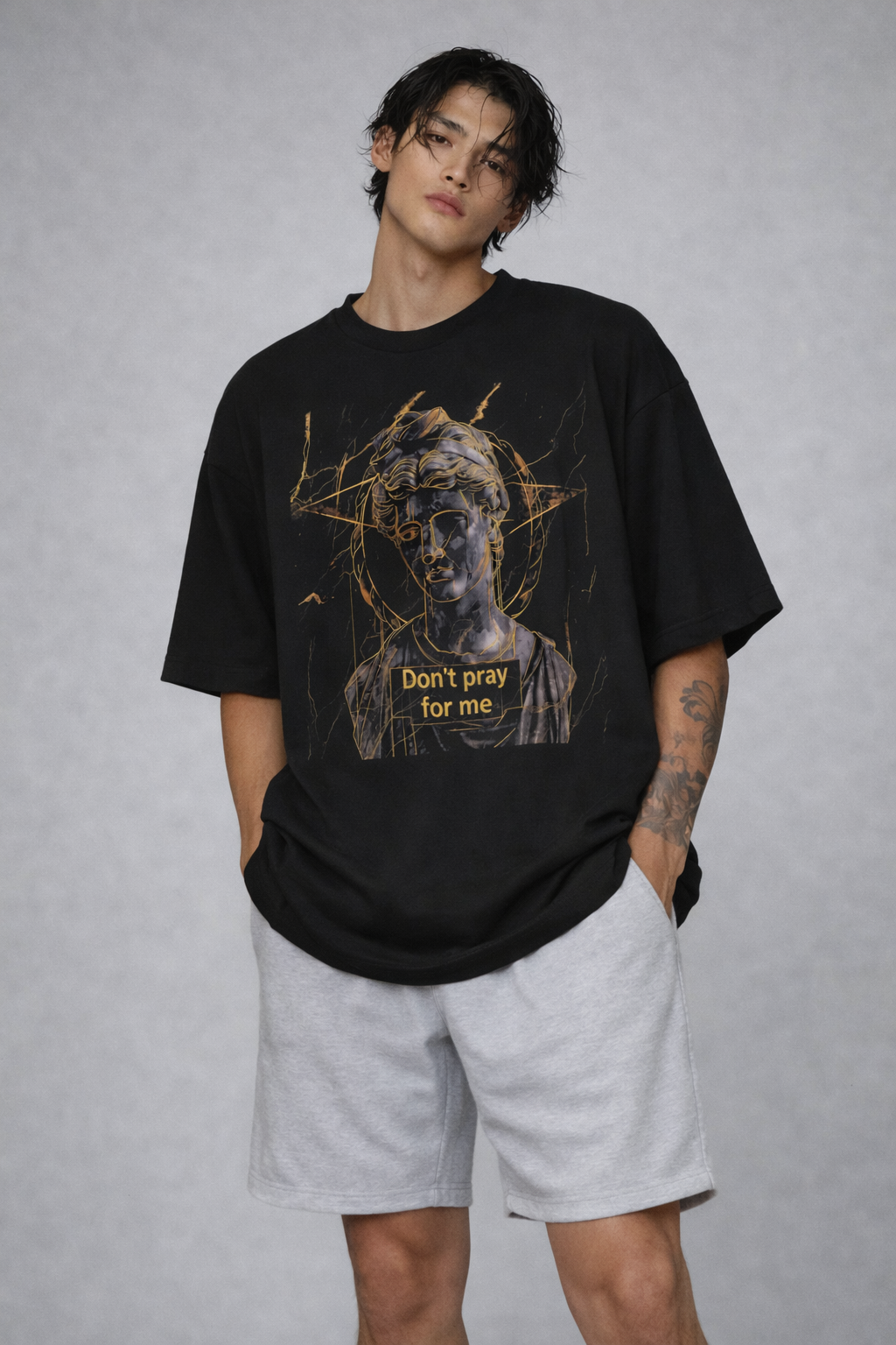 male model full body front view wearing oversized black graphic streetwear t shirt david statue dont pray for me urban streetwear outfit