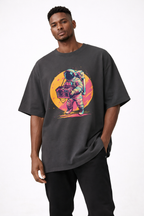 male model front view wearing oversized black graphic streetwear t shirt astronaut boombox sunset design urban streetwear outfit