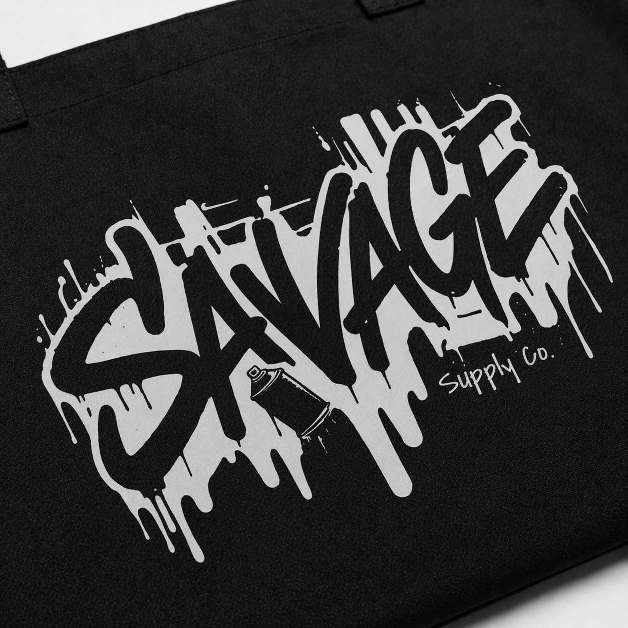 product close up black tote bag savage graffiti logo texture detail graphic streetwear