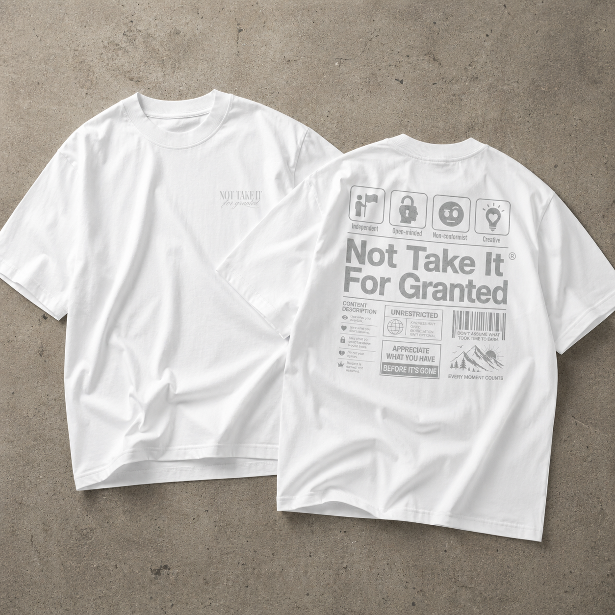 oversized white graphic t-shirt set showing front minimalist chest logo and back large statement design on concrete background urban streetwear outfit