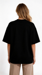 female model back view wearing oversized black streetwear t shirt blank back minimal urban streetwear clothing