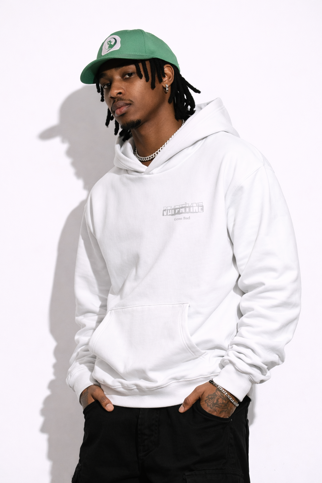 Noiré white oversized streetwear hoodie front view with bold letter Valentine gone bad, worn by male model, urban unisex hoodie.