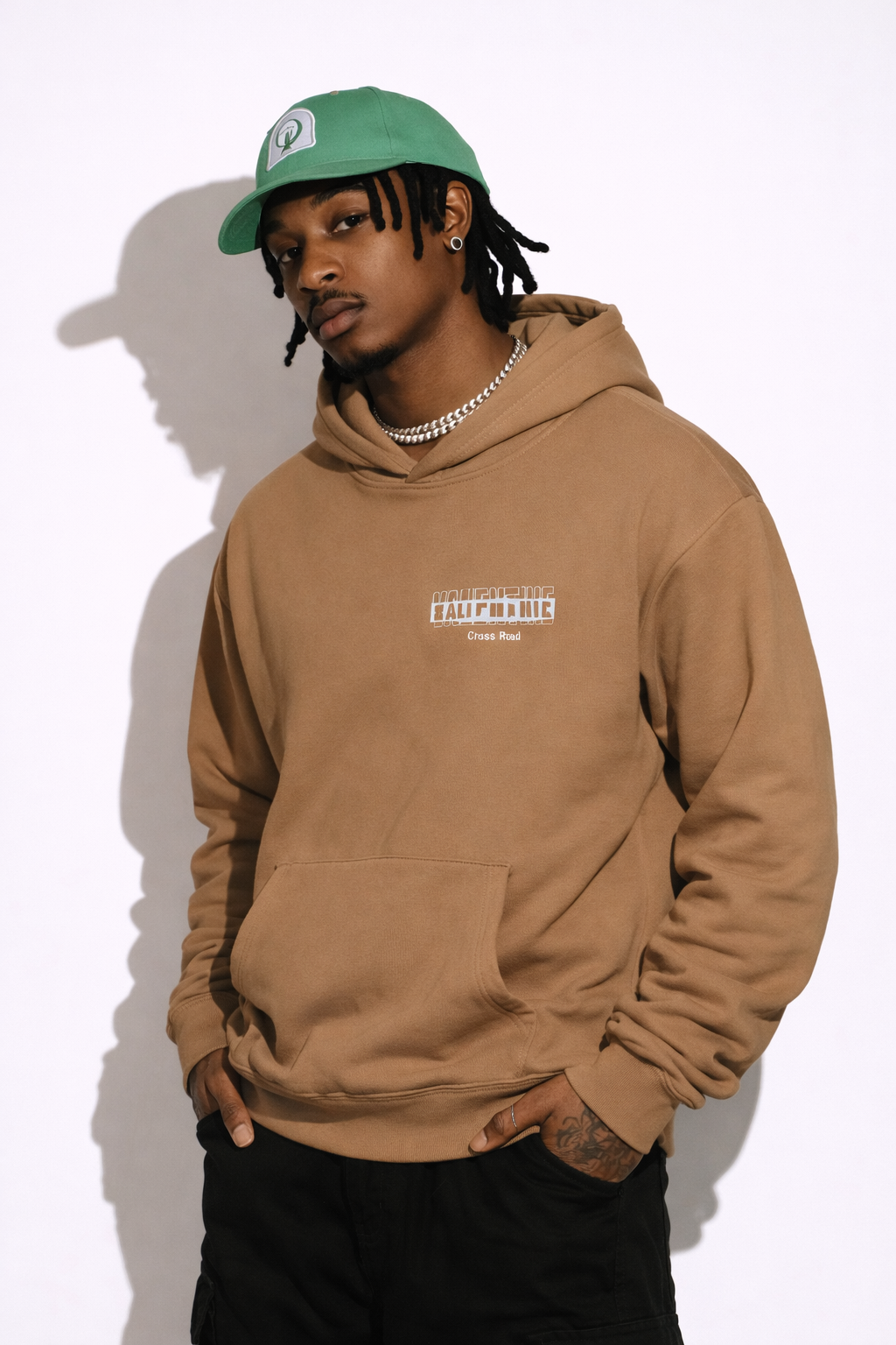 Noiré brown oversized streetwear hoodie front view with bold letter Valentine gone bad, worn by male model, urban unisex hoodie.