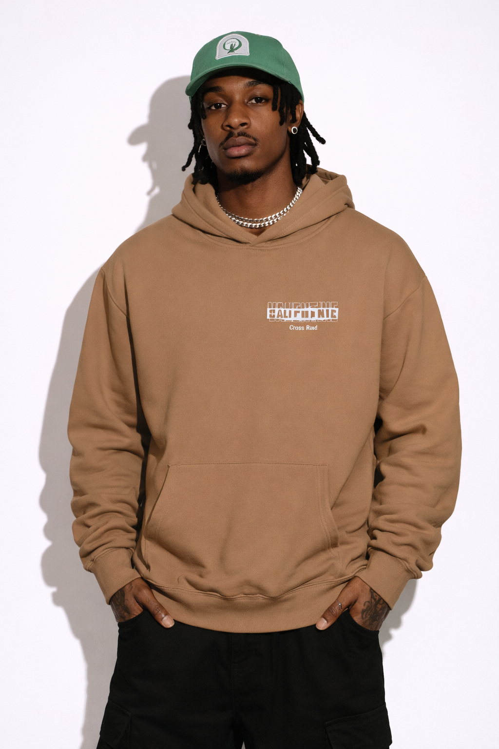 Noiré brown oversized streetwear hoodie front view with bold letter Valentine gone bad, worn by male model, urban unisex hoodie.