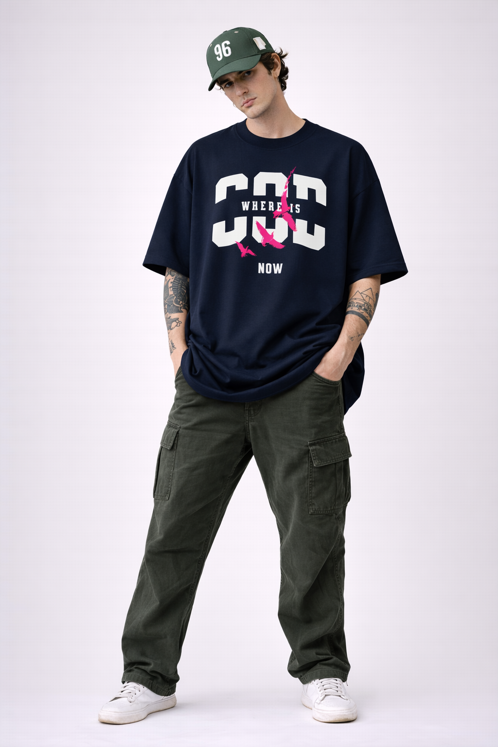 Oversized navy Noiré graphic T-shirt with “Where Is God Now” statement print and pink birds, contemporary urban fashion look.