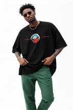 Men’s black oversized Noiré graphic T-shirt with minimalist front skull logo, contemporary urban fashion look.