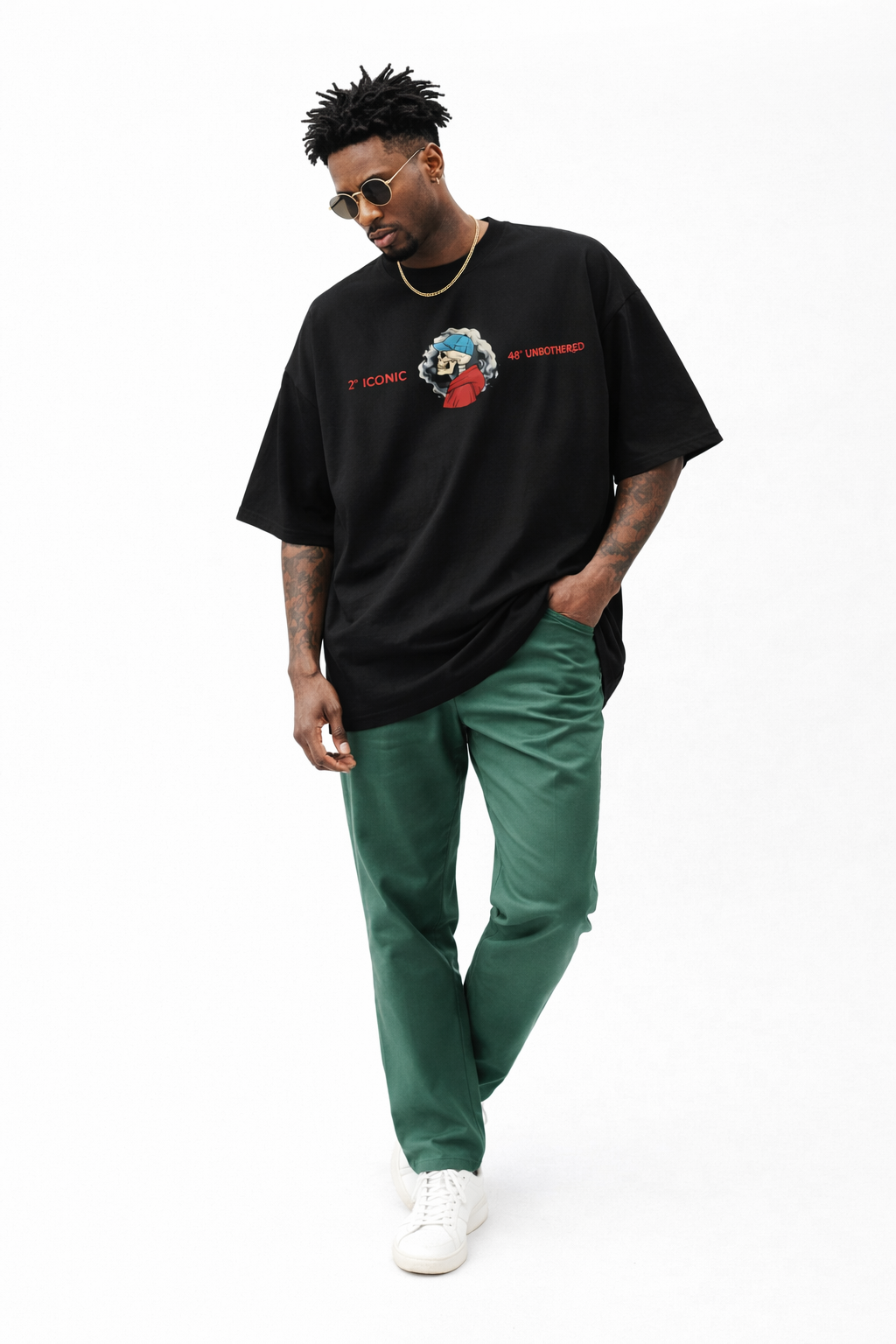 Men’s black oversized Noiré graphic T-shirt with minimalist front skull logo, contemporary urban fashion look.