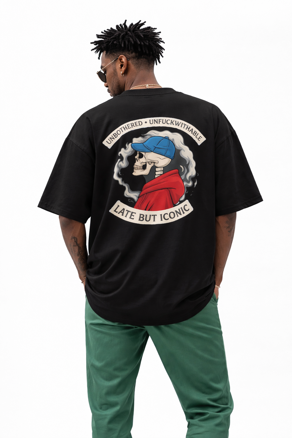 Oversized black Noiré graphic T-shirt with large back print “Unbothered · Unfuckwithable – Late But Iconic”, urban streetwear style.