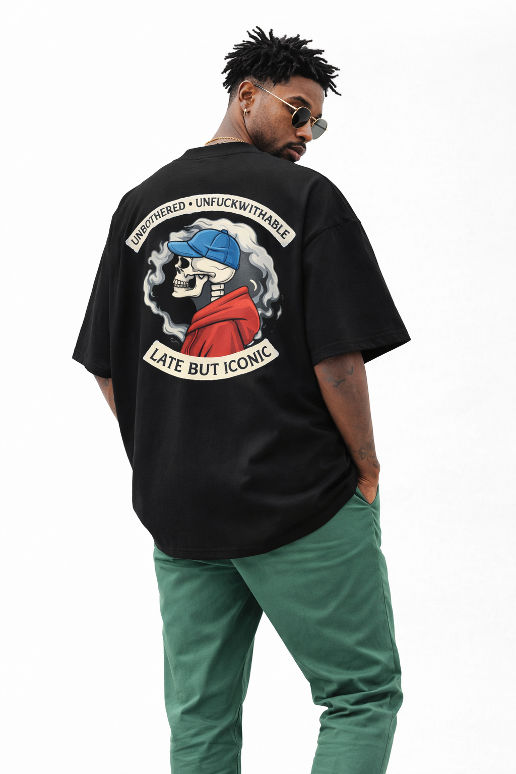 Black oversized Noiré T-shirt back view featuring “Unbothered · Unfuckwithable – Late But Iconic” skull graphic, bold streetwear design.