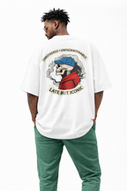 White oversized Noiré T-shirt back view with “Unbothered · Unfuckwithable – Late But Iconic” skull artwork, statement streetwear piece.