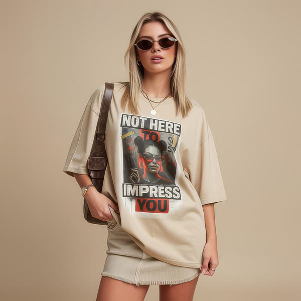 Model wearing unisex graphic t-shirt with bold typography and portrait design in a studio setting