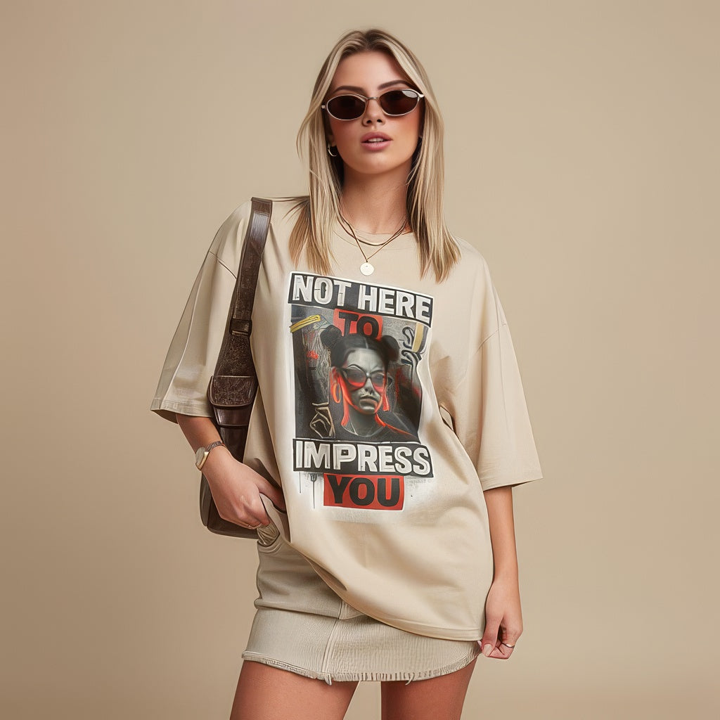 Model wearing unisex graphic t-shirt with bold typography and portrait design in a studio setting
