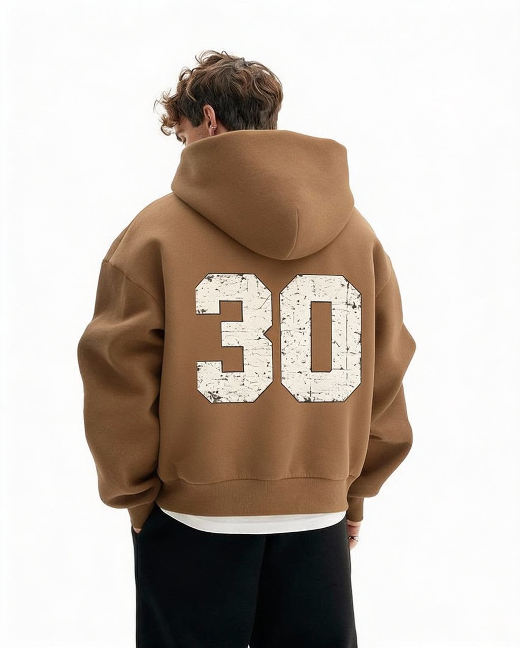 Noiré brown oversized streetwear hoodie back view with large distressed “30” varsity number print, worn by male model, urban graphic hoodie.