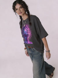 model wearing dark gray oversized unisex t-shirt front view with neon purple and pink female portrait graphic art
