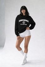 female model wearing black confidence fits everything sweatshirt front view studio shot

