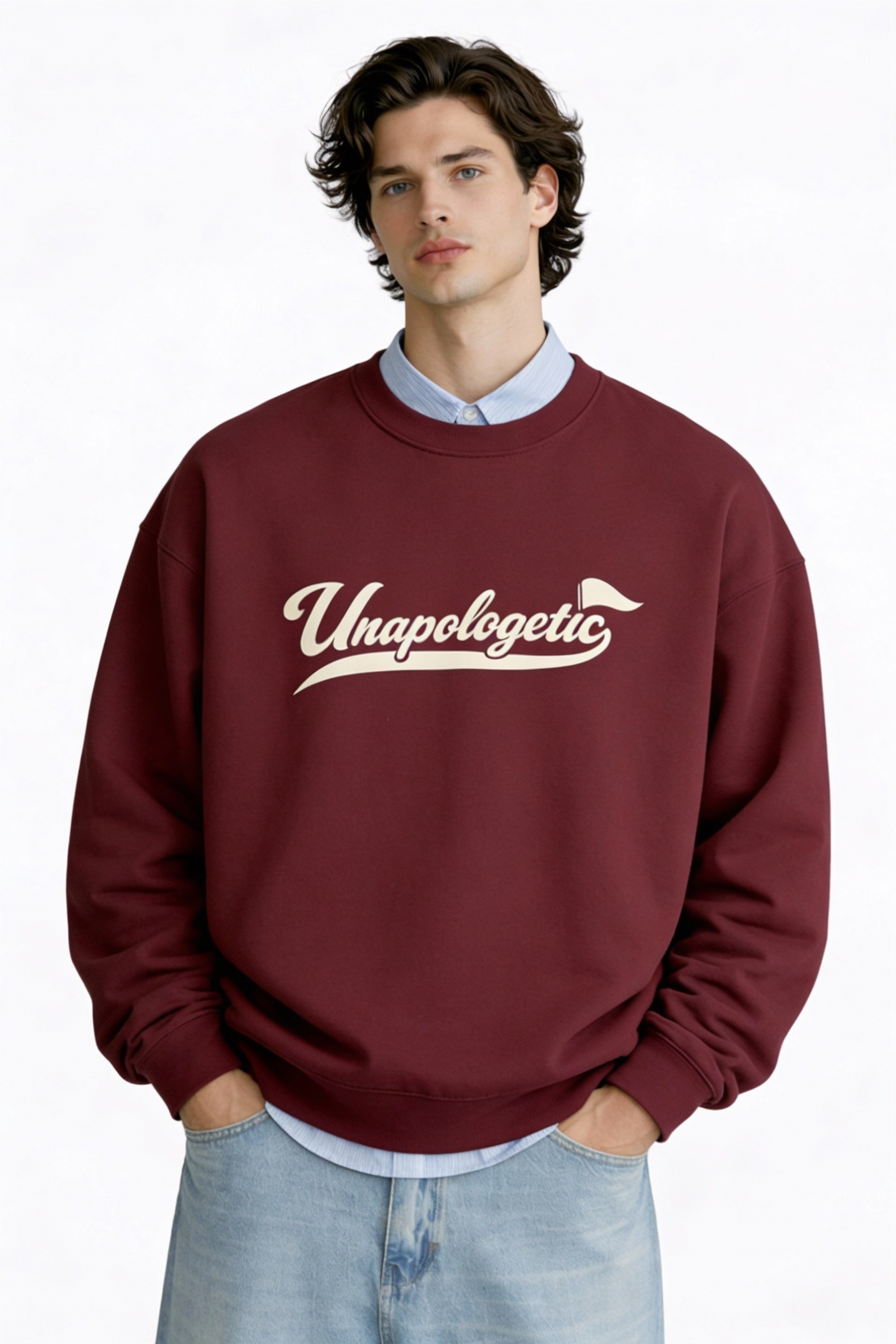 Noiré Unapologetic burgundy oversized crewneck sweatshirt, front view on male model, cream script logo