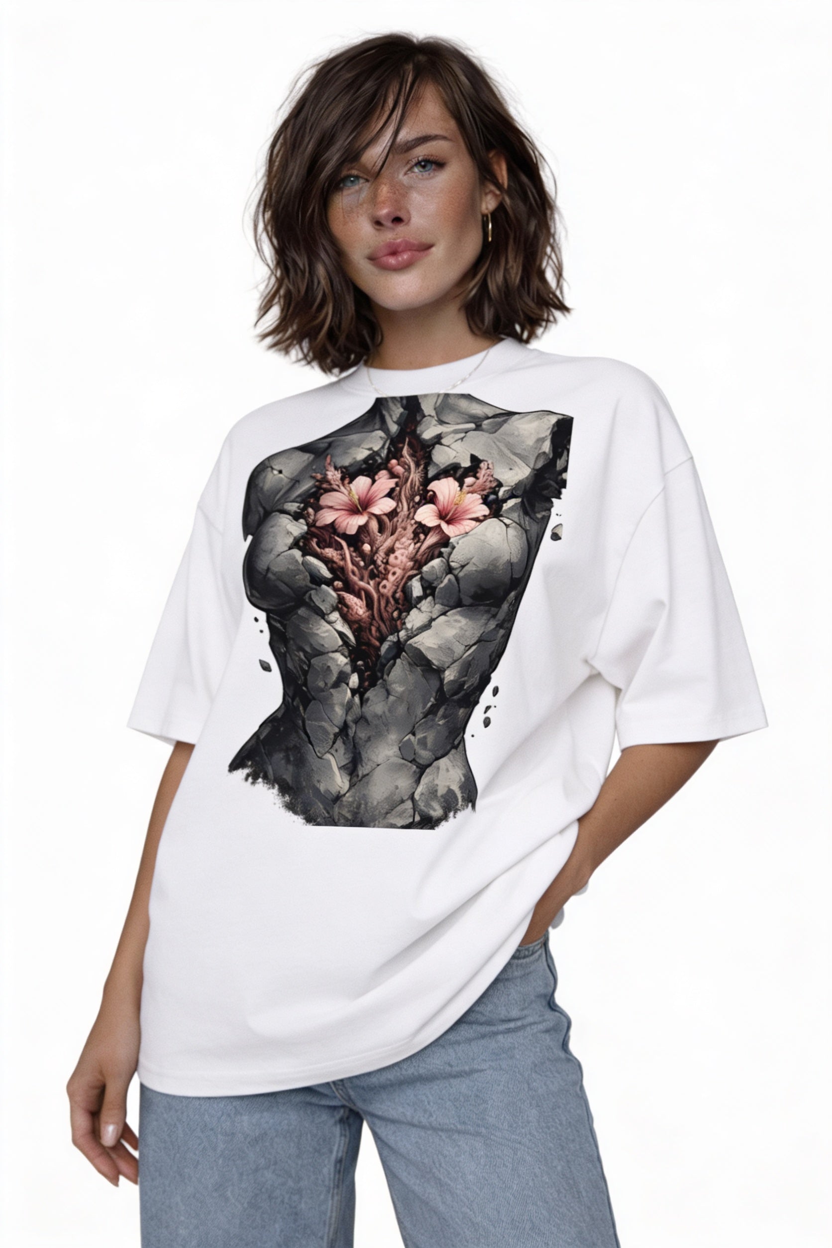 Model wearing oversized white artistic graphic t-shirt with fractured stone torso and flowers design
