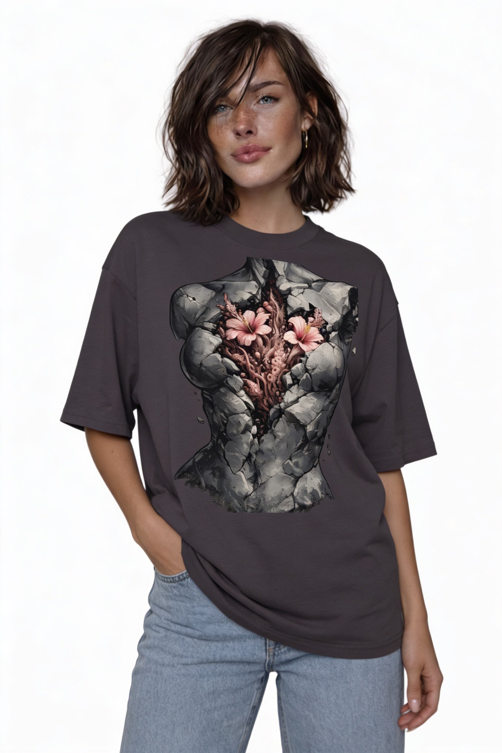 Model wearing oversized grey artistic graphic t-shirt with fractured stone torso and flowers design
