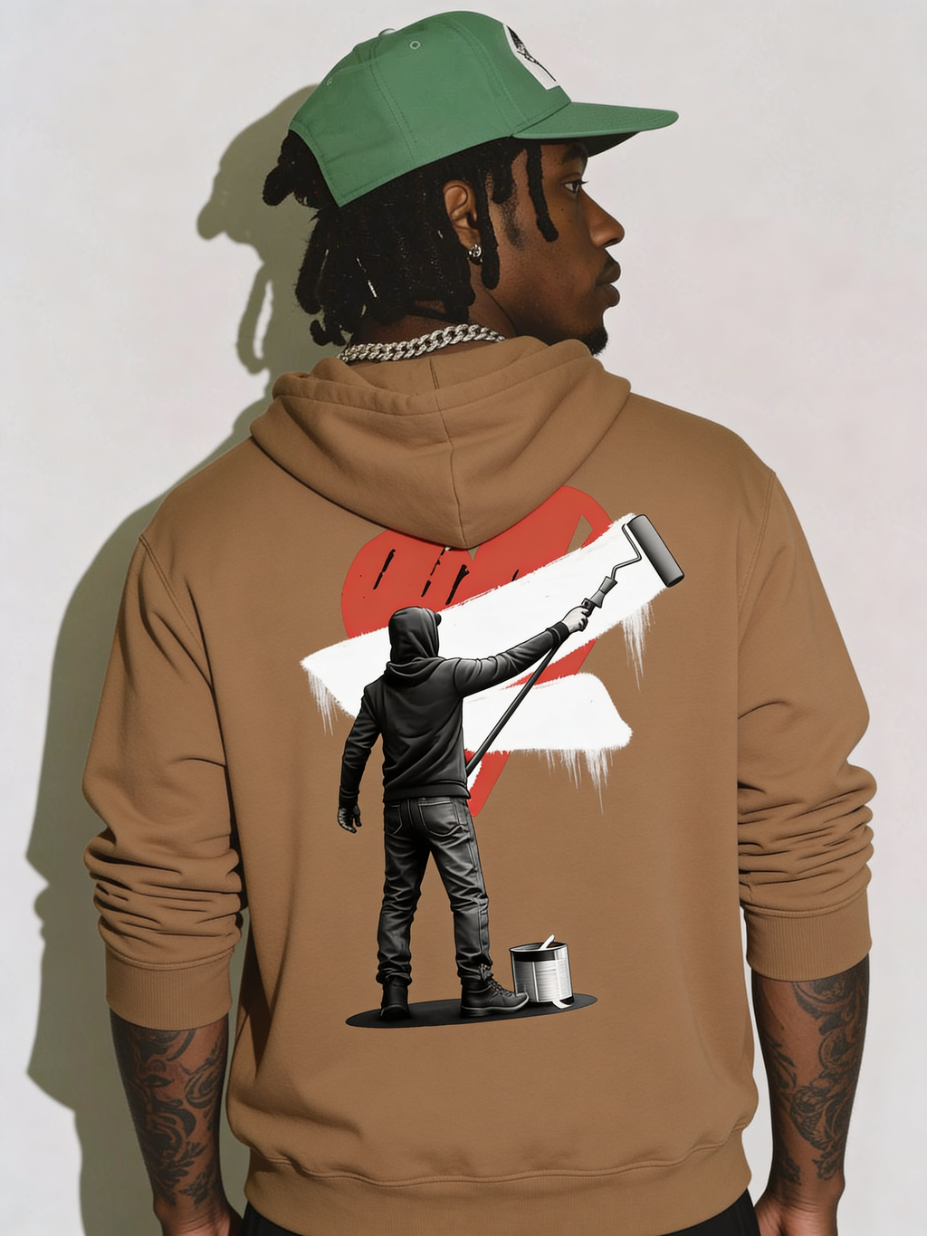 Noiré brown  oversized hoodie back view with large red heart and artistic streetwear character print, worn by male model, statement graphic hoodie.