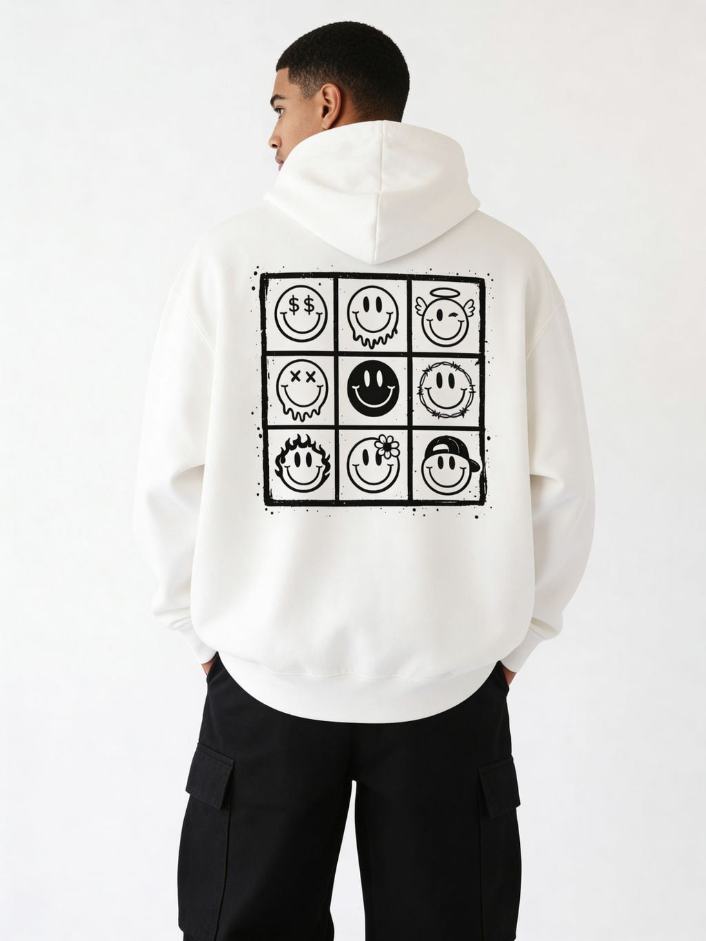 Noiré white oversized hoodie back view with large 9-panel smiley face graphic grid print, worn by male model, streetwear statement hoodie.