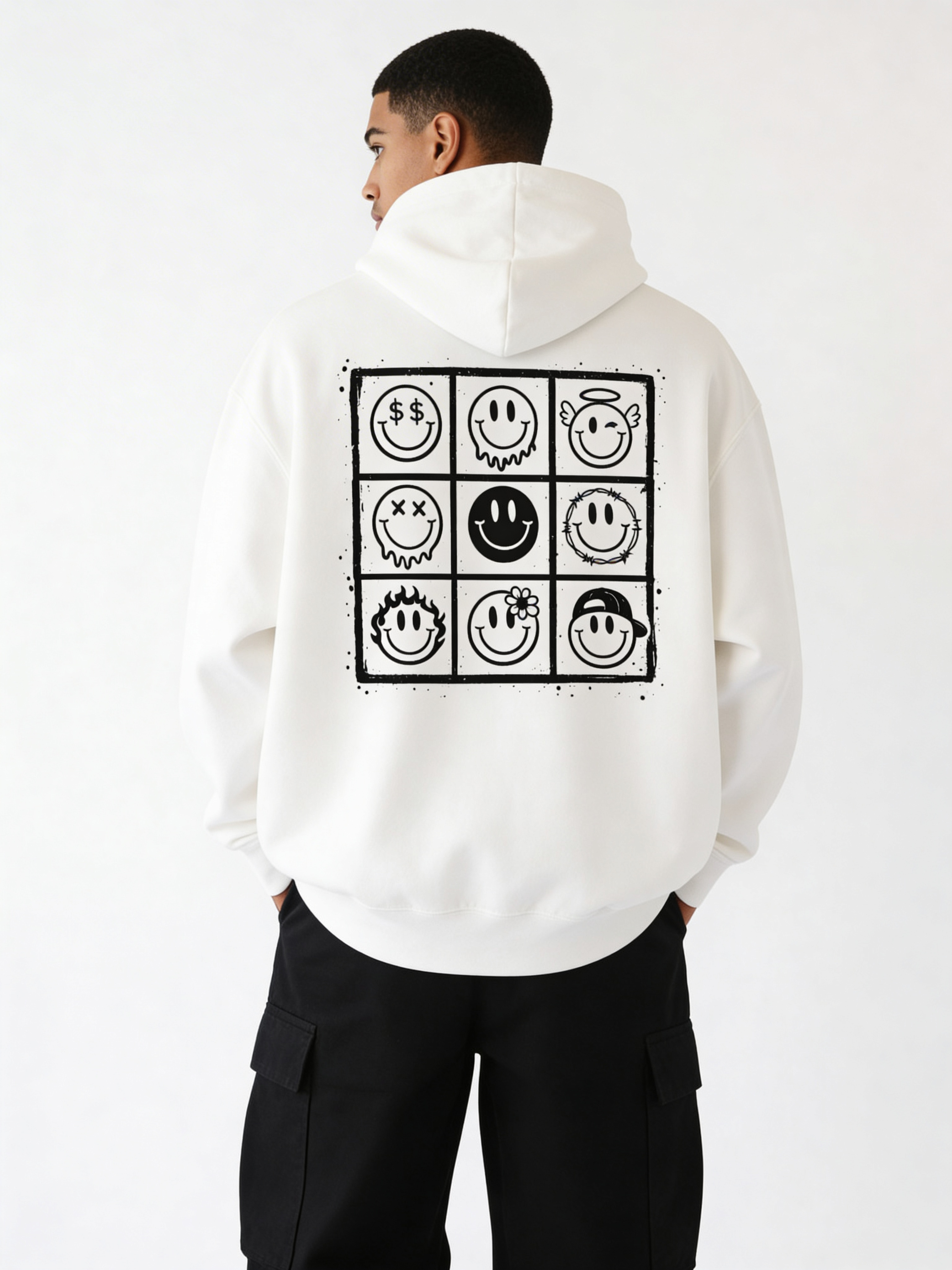 Noiré white oversized hoodie back view with large 9-panel smiley face graphic grid print, worn by male model, streetwear statement hoodie.