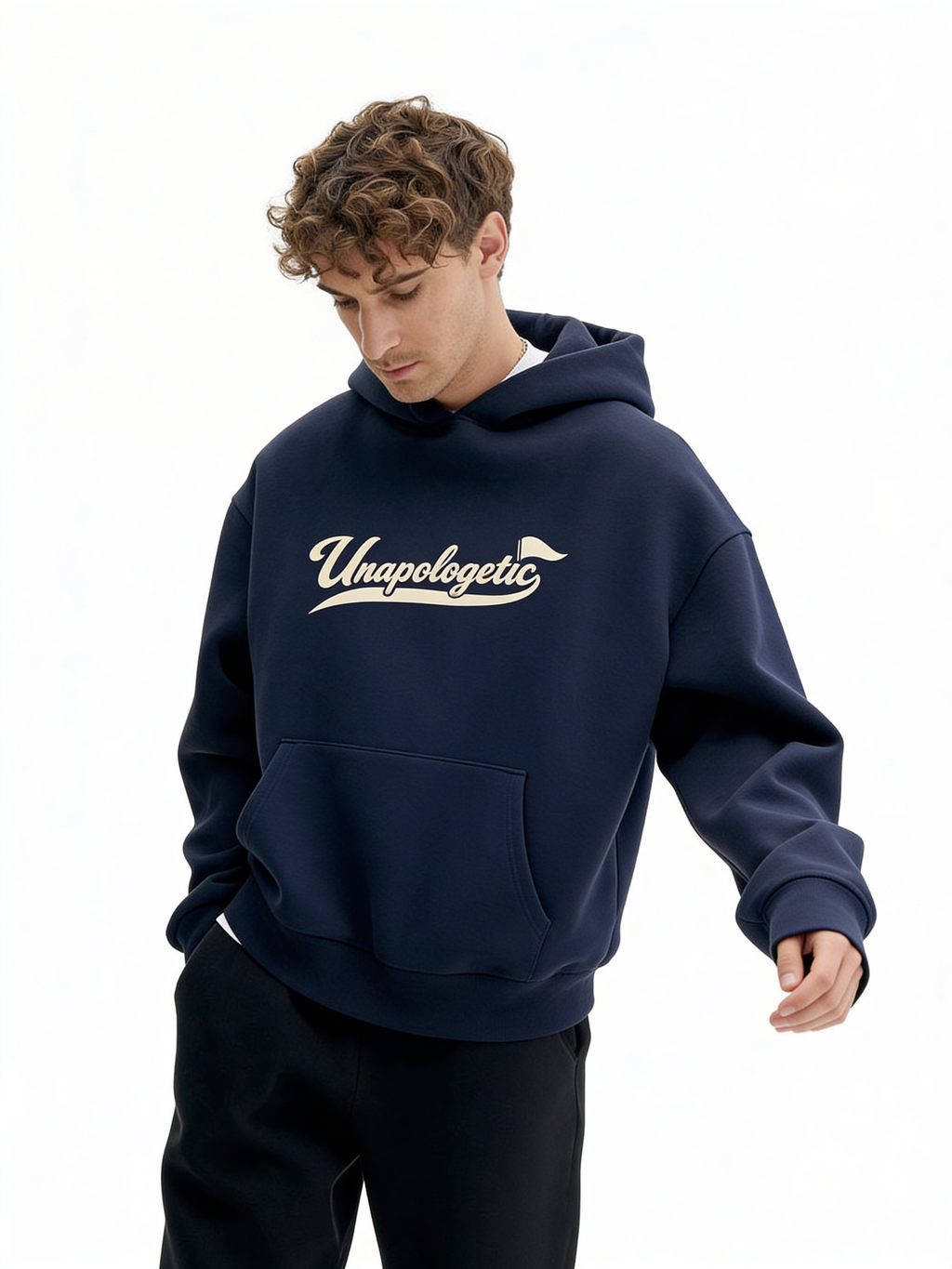 Noiré navy oversized streetwear hoodie front view with “Unapologetic” script graphic in beige, worn by male model, unisex statement hoodie.