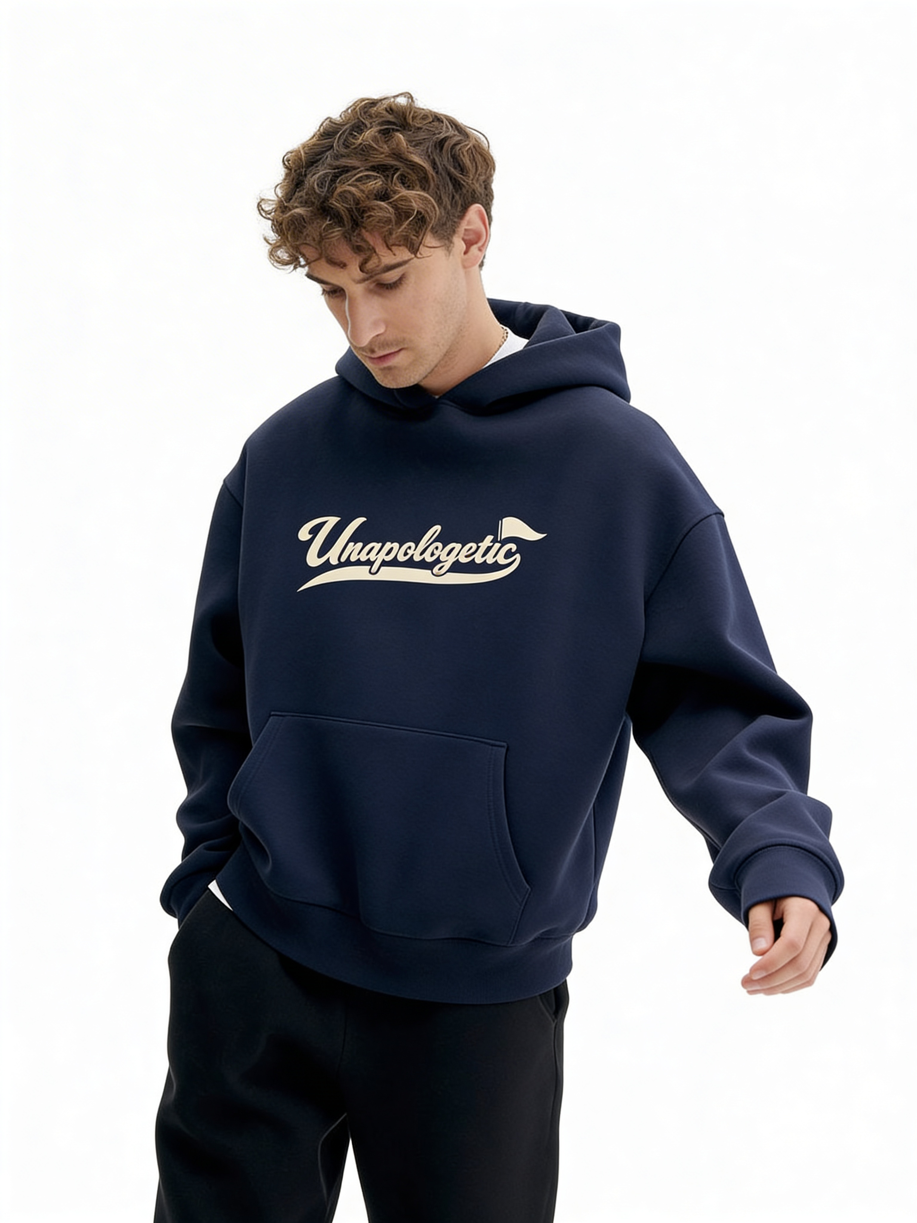 Noiré navy oversized streetwear hoodie front view with “Unapologetic” script graphic in beige, worn by male model, unisex statement hoodie.