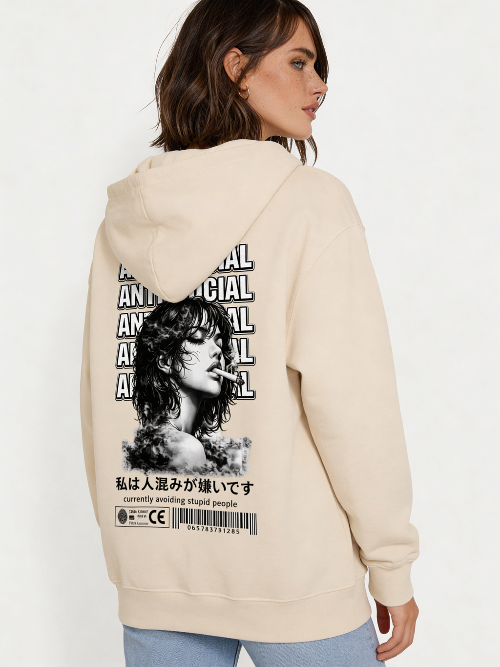 Noiré beige oversized hoodie back view featuring large “Anti-Social” text design and artistic portrait print, worn by female model, urban streetwear graphic hoodie.
