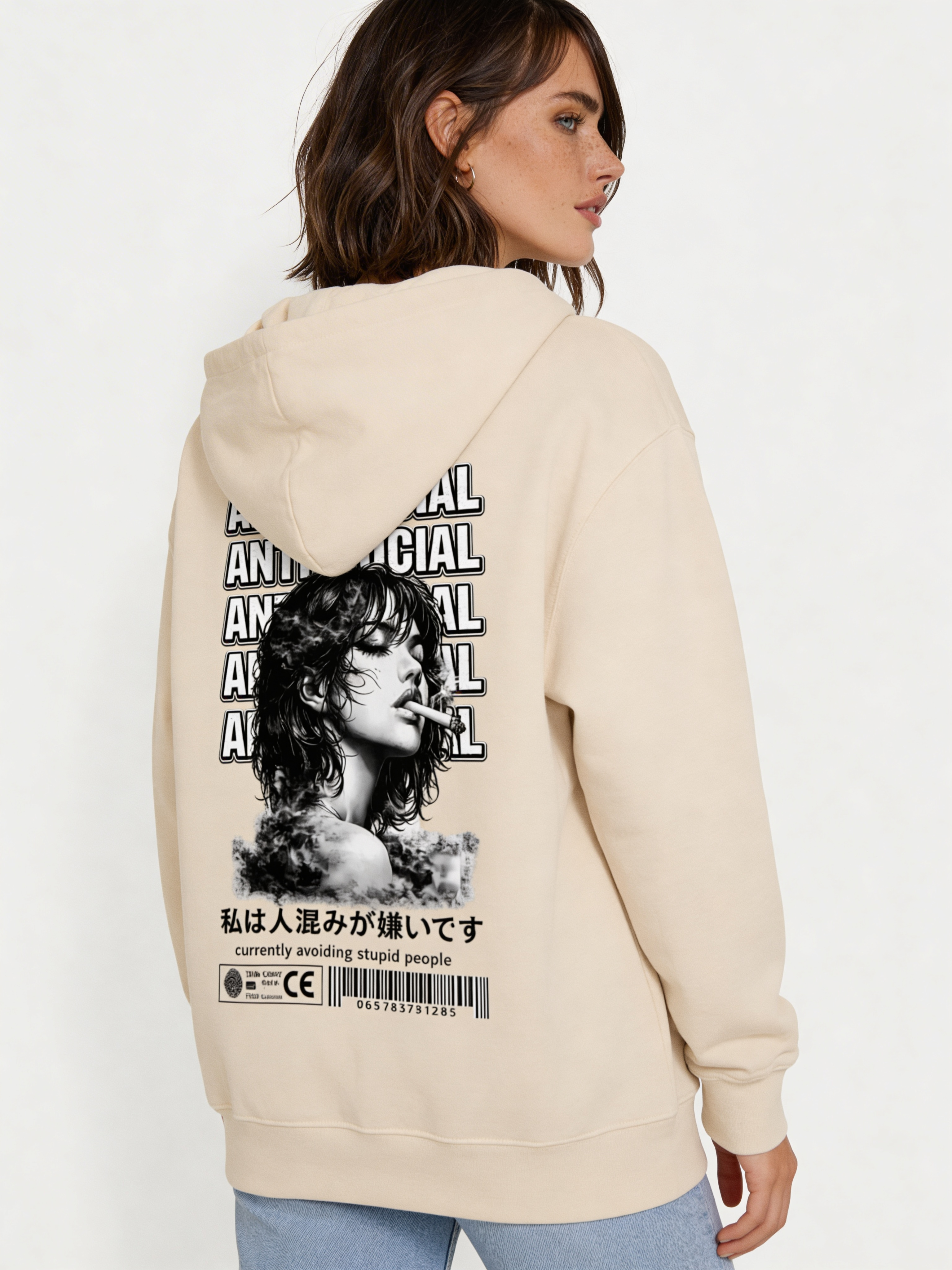 Noiré beige oversized hoodie back view featuring large “Anti-Social” text design and artistic portrait print, worn by female model, urban streetwear graphic hoodie.