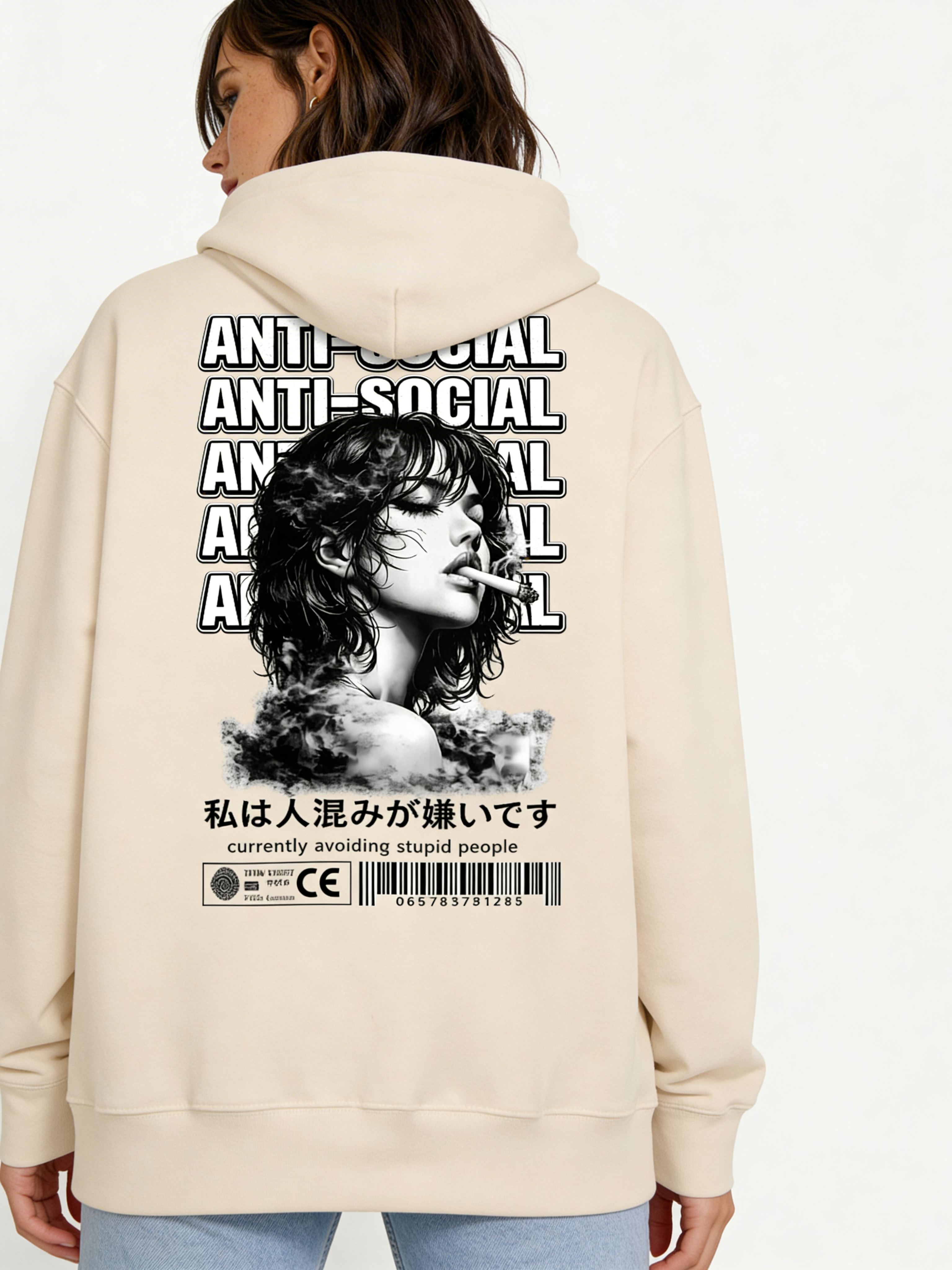 Noiré beige oversized hoodie back view featuring large “Anti-Social” text design and artistic portrait print, worn by female model, urban streetwear graphic hoodie.