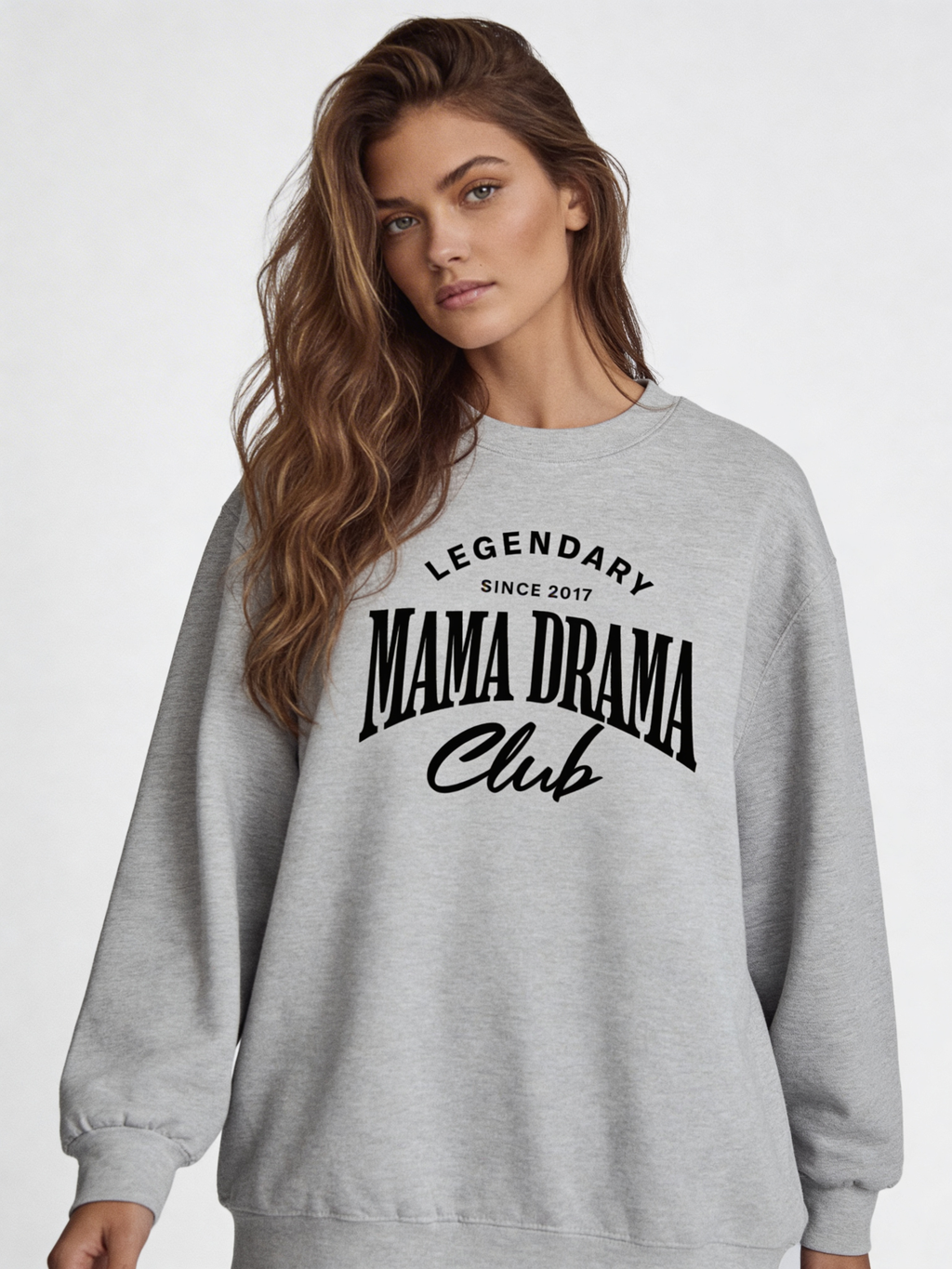 Noiré Legendary Mama Drama Club oversized crewneck sweatshirt for women in grey, front view, bold black typography graphic, streetwear aesthetic.
