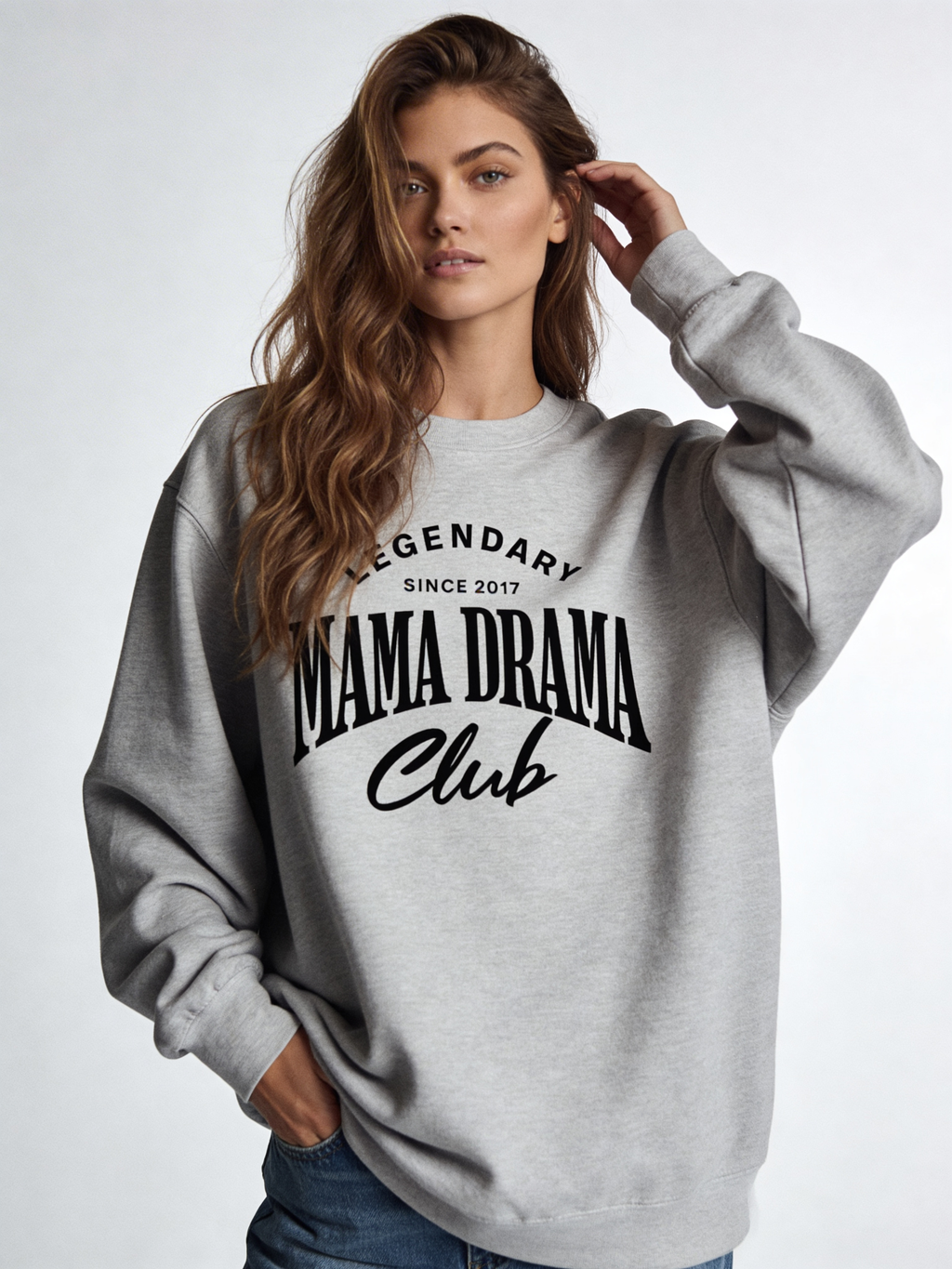 Noiré Legendary Mama Drama Club oversized crewneck sweatshirt for women in grey, front view, bold black typography graphic, streetwear aesthetic.