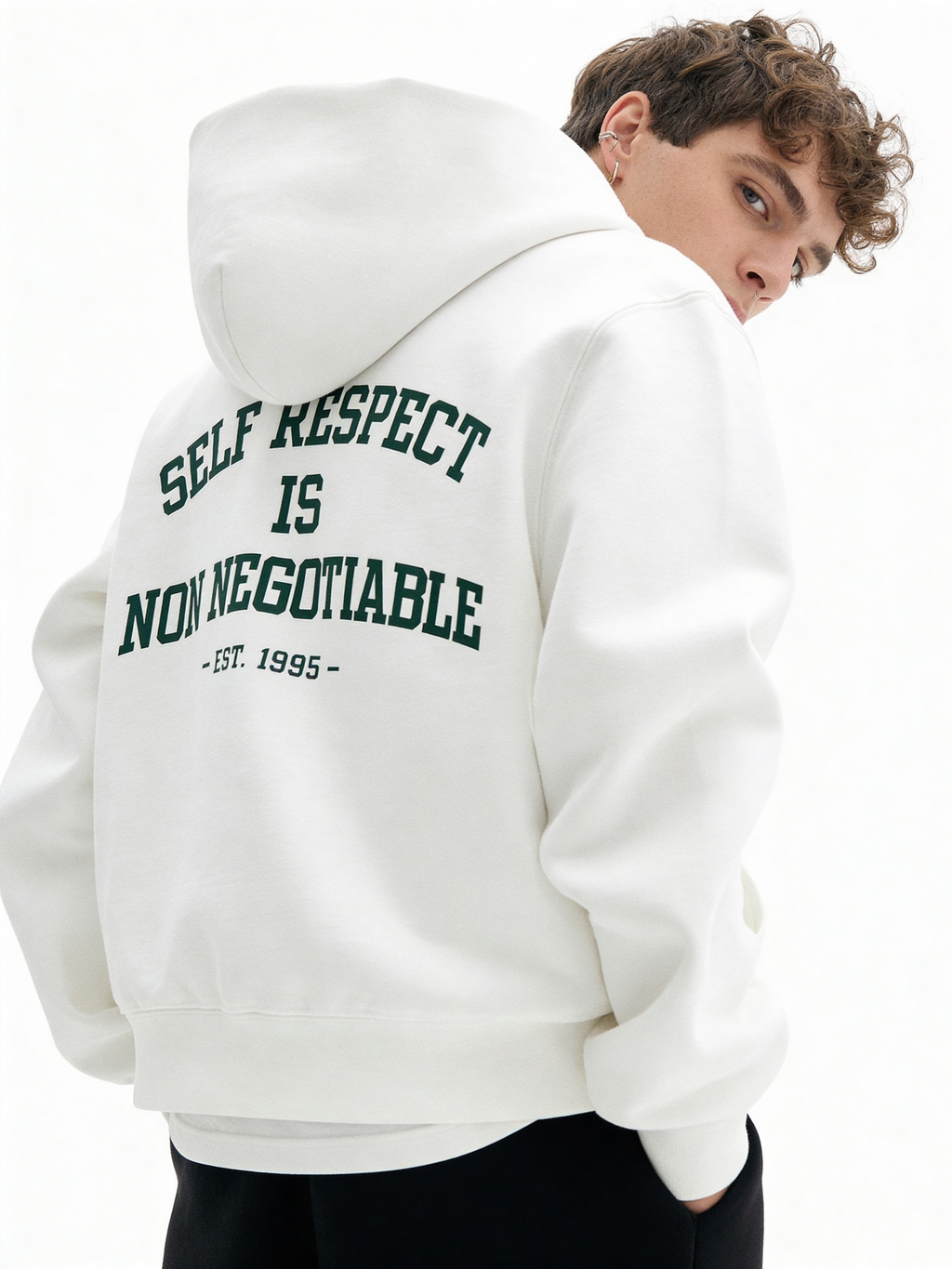 White oversized hoodie back view on male model with green “Self Respect Is Non Negotiable – EST. 1995” varsity typography
