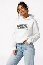 female model side pose wearing oversized white motivational hoodie self comparison quote design streetwear fashion
