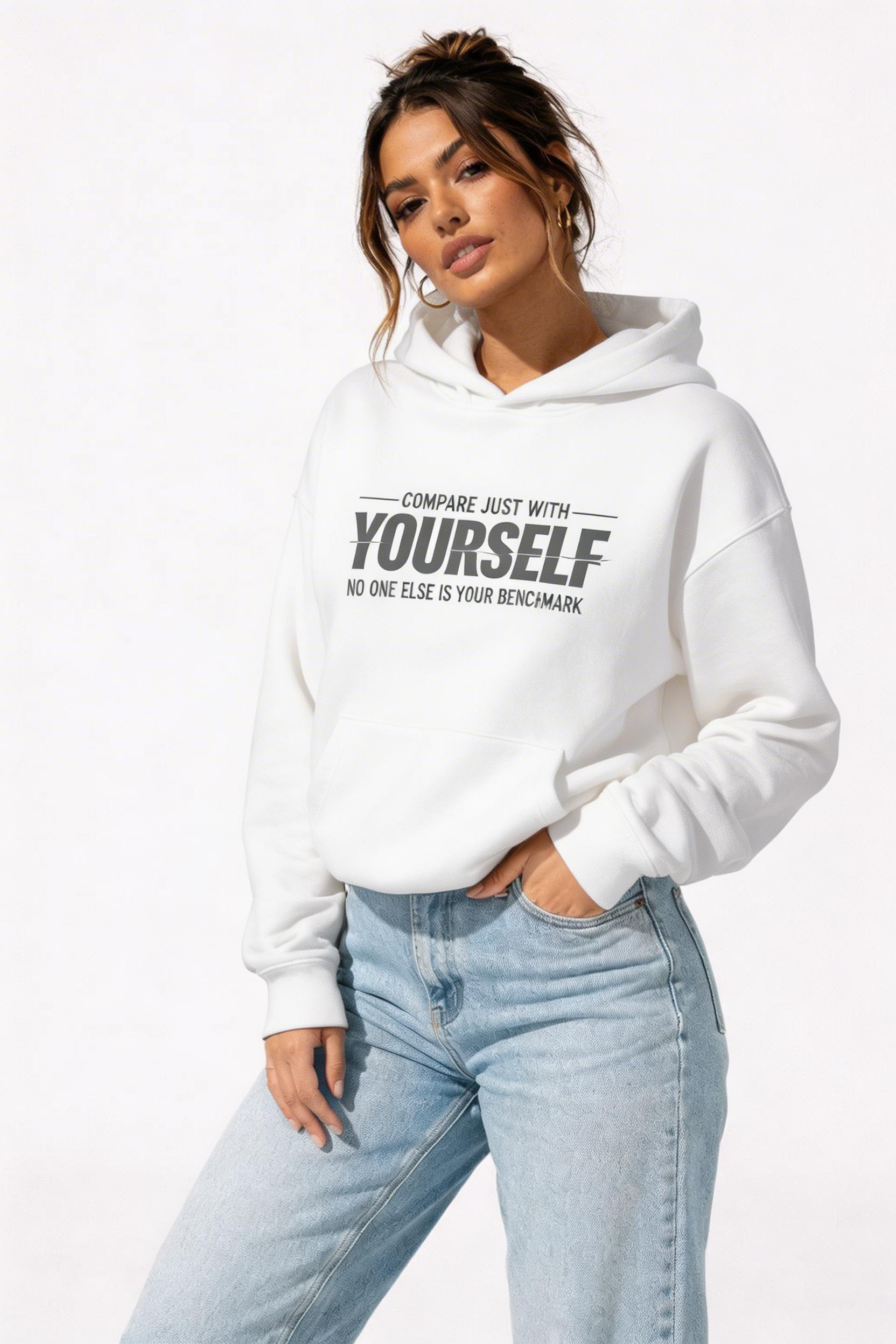 female model side pose wearing oversized white motivational hoodie self comparison quote design streetwear fashion