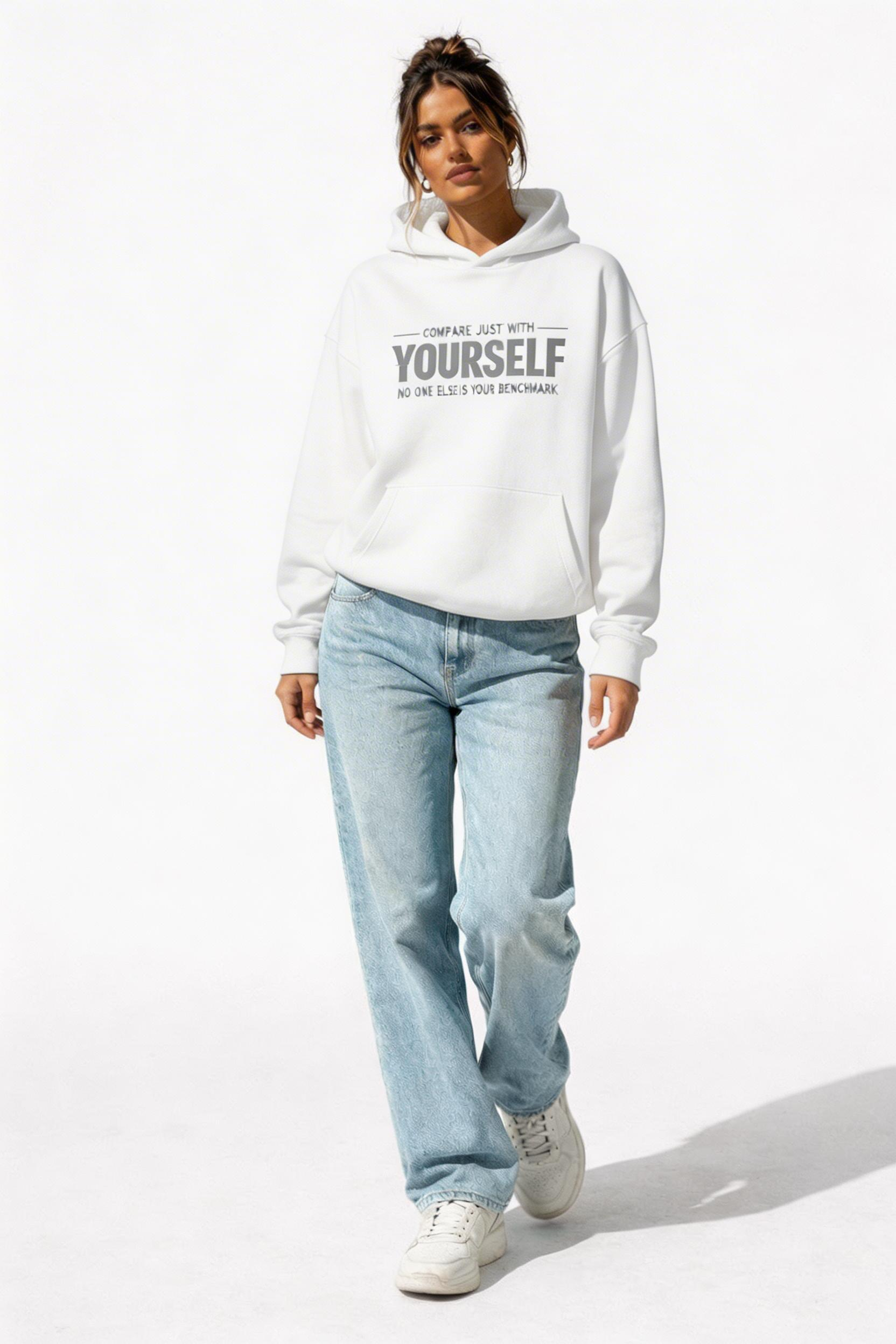 female model walking full body wearing oversized white motivational hoodie compare yourself typography design urban streetwear clothing