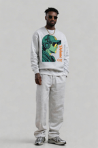male model standing relaxed pose wearing oversized grey sweatshirt with bold graphic print urban streetwear outfit