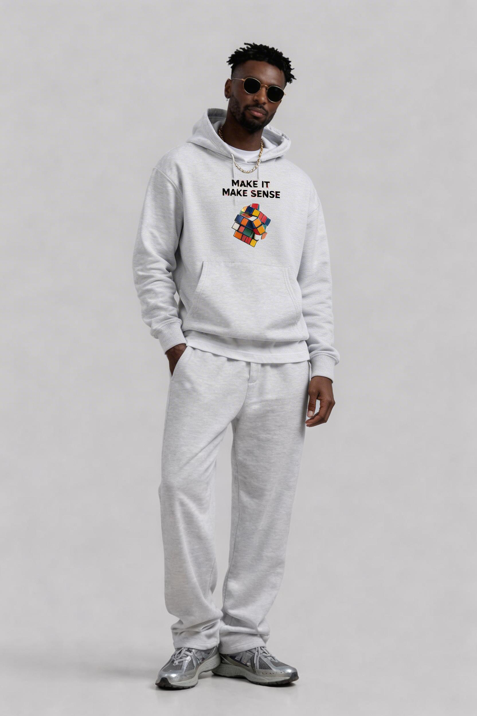 male model standing front pose wearing oversized grey hoodie with rubik cube graphic modern streetwear fashion