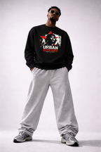 male model full body pose wearing oversized black graphic sweatshirt urban resistance design urban streetwear outfit