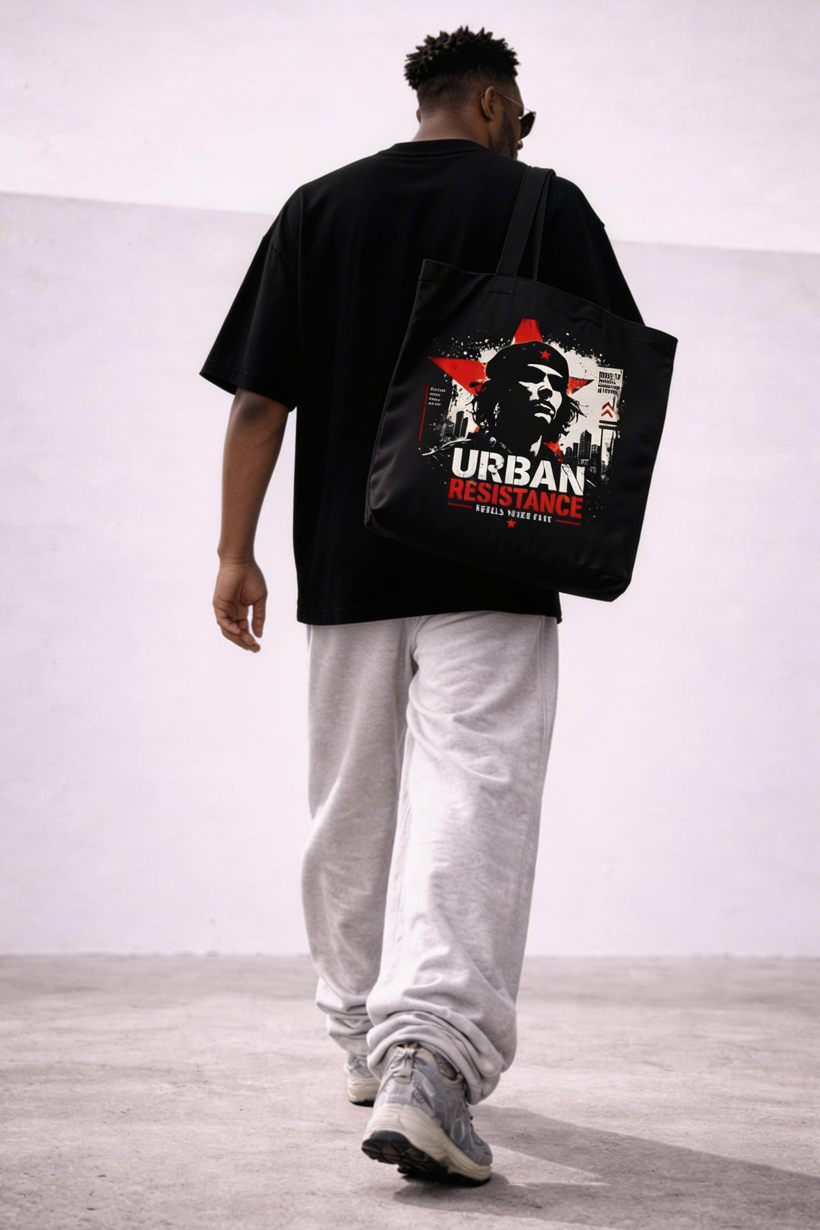 male model back view carrying black tote bag urban resistance graphic streetwear outfit