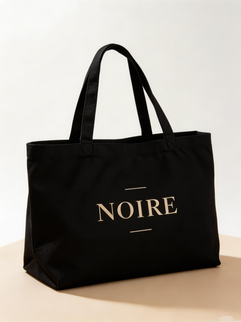 black oversized eco tote bag angled view NOIRE logo minimalist design premium canvas shopper bag