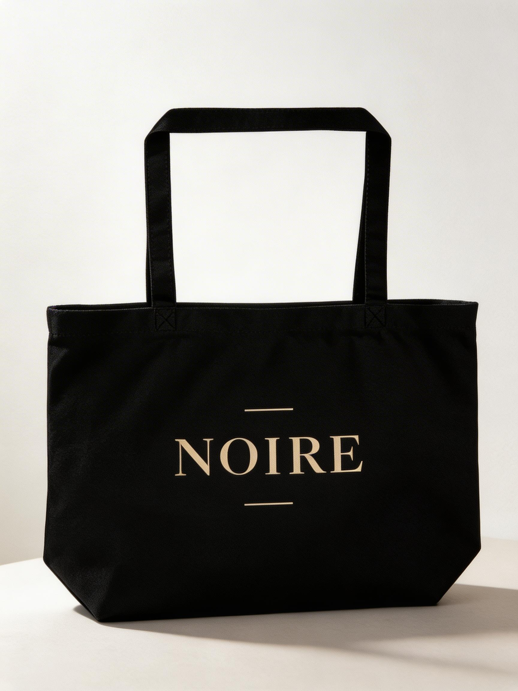 black oversized eco tote bag front view product mockup NOIRE logo minimal streetwear canvas tote bag