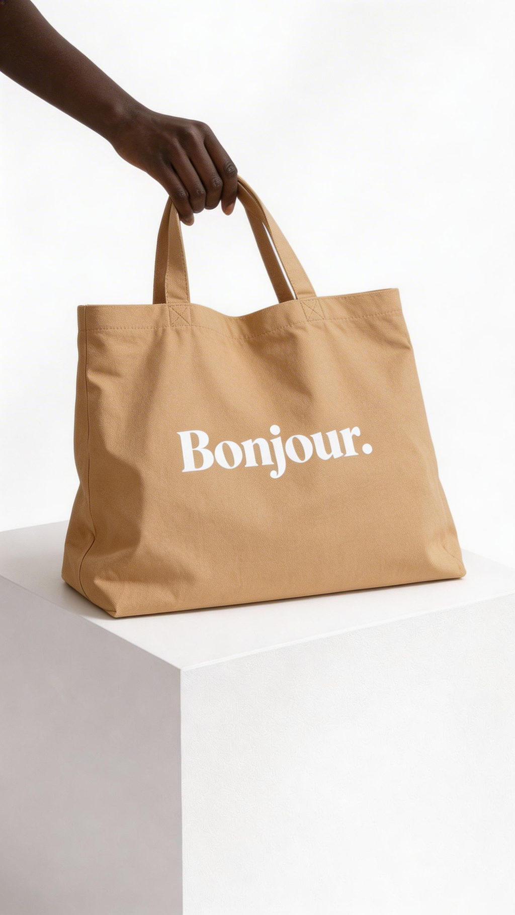 model holding beige tote bag bonjour typography design streetwear fashion