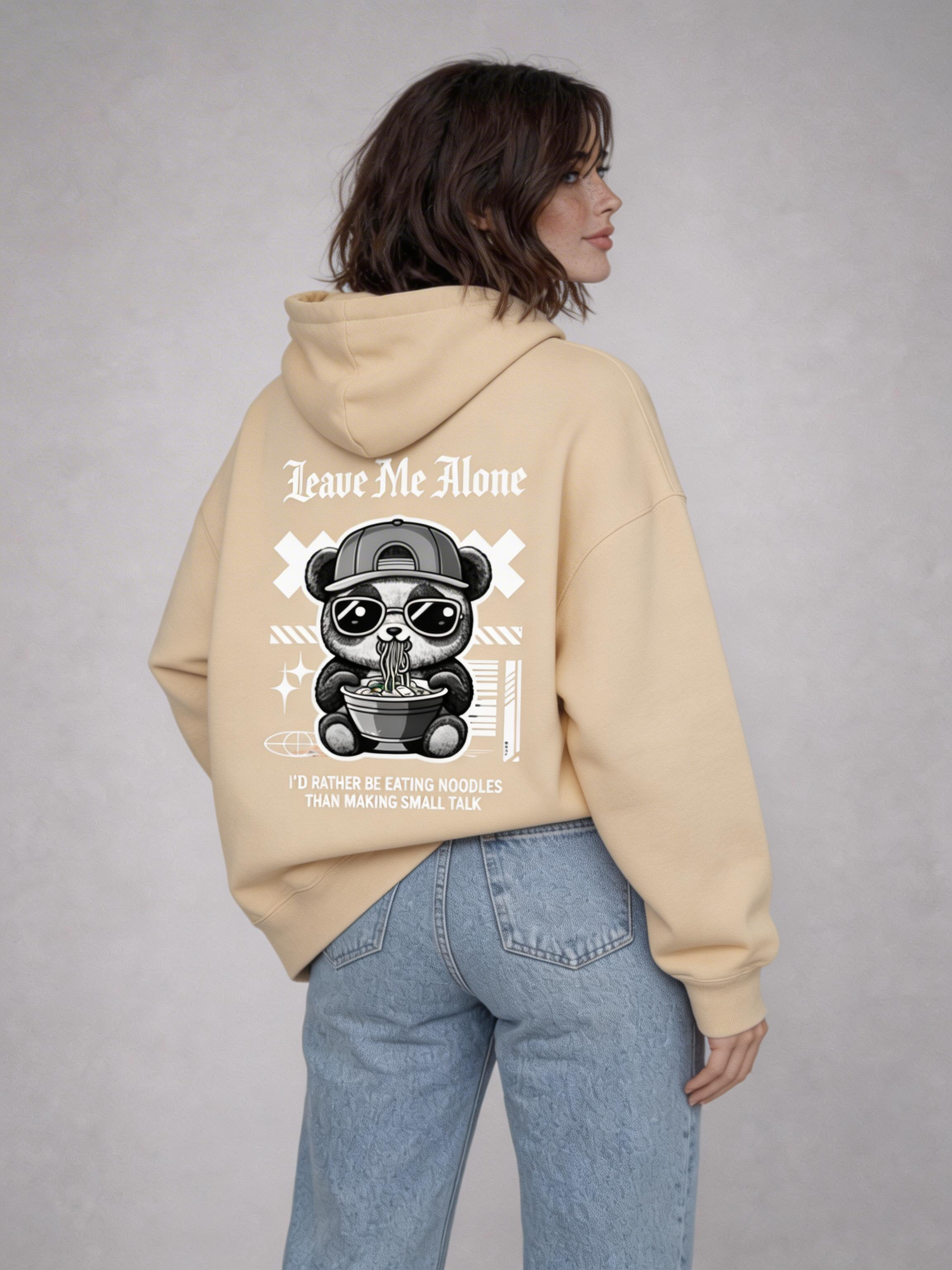 female model back view wearing oversized beige graphic streetwear hoodie gothic teddy bear illustration urban streetwear outfit