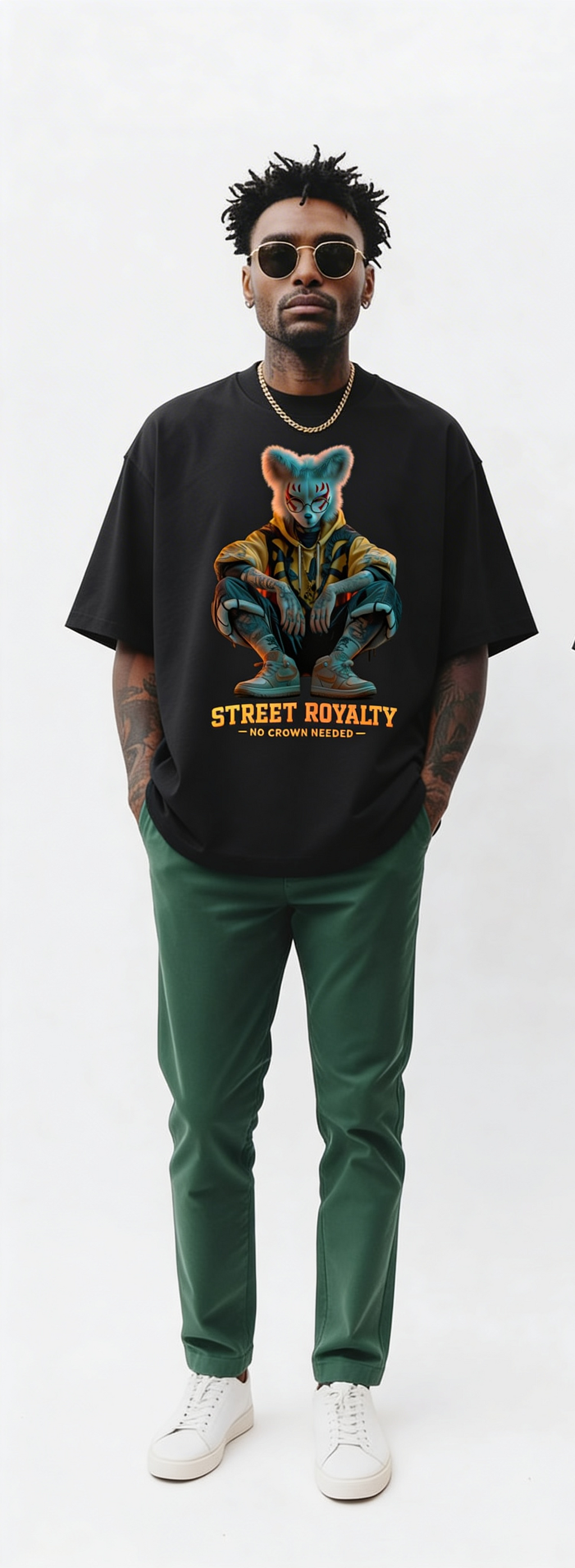 Black oversized streetwear t-shirt with “Street Royalty – No Crown Needed” fox character graphic worn by male model, urban minimalist studio background, modern street fashion.