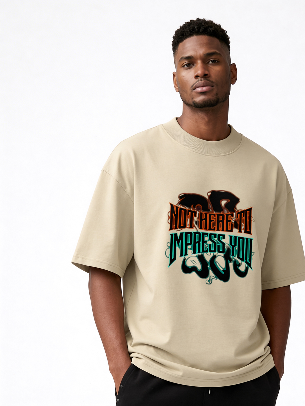 Beige oversized streetwear t-shirt with “Not Here to Impress You” bold lettering graphic worn by male model, casual urban style.